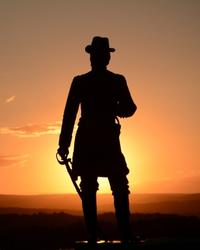 Silhouette of man with sword